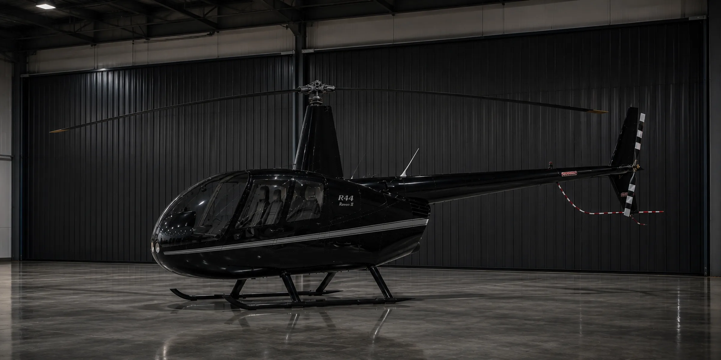 Helicopter clean and ready for flight in an open hangar