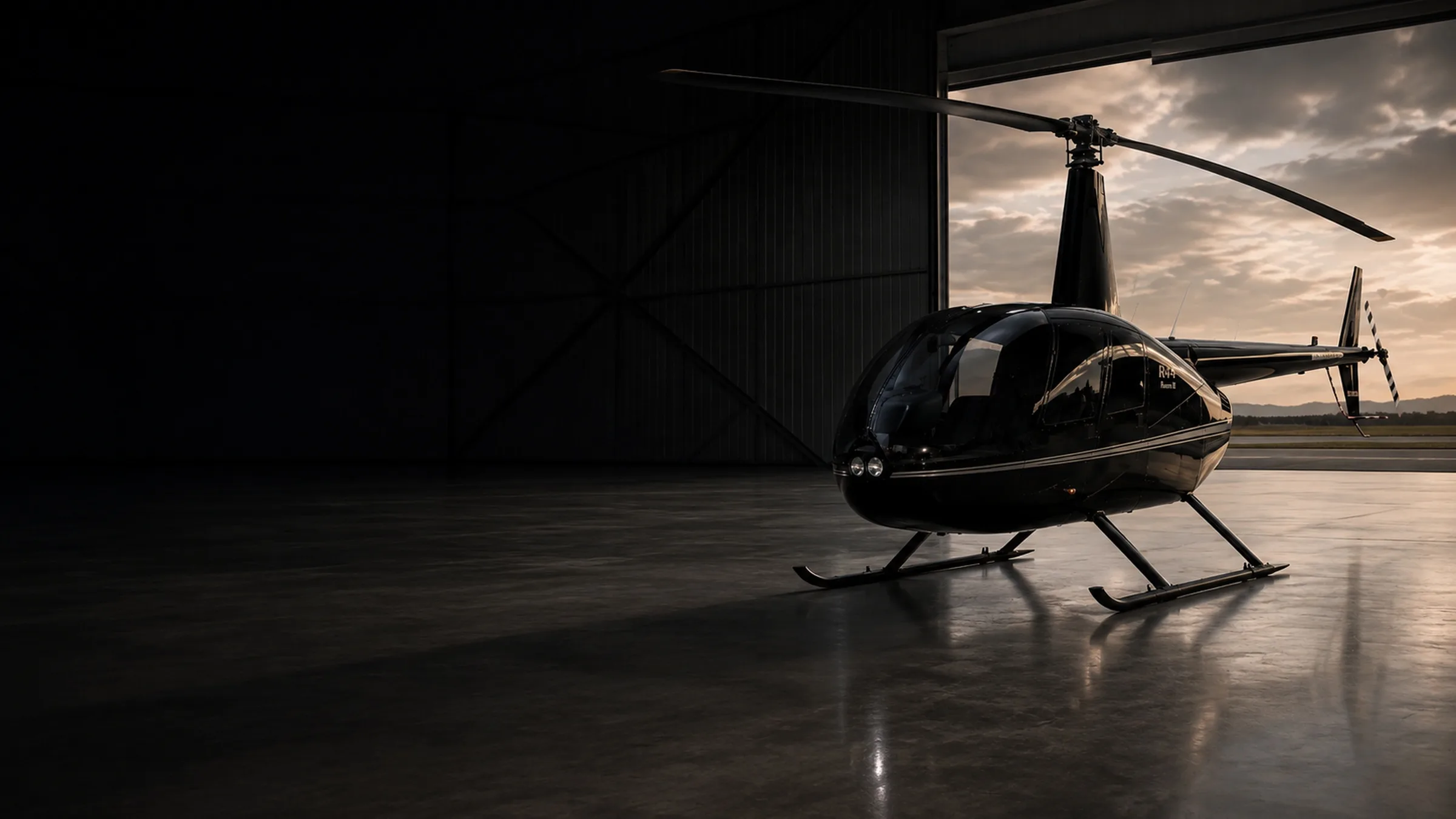 Robinson R44 helicopter in a hangar after detailing by SORA